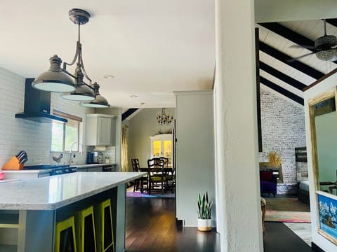 Open concept kitchen, dining room and two living rooms on main level.