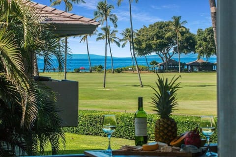 Enjoy alfresco meals with stunning ocean views from this cozy outdoor dining setup