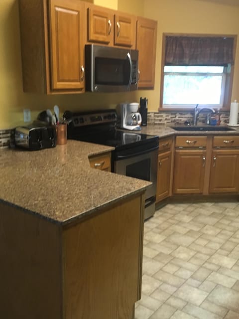 Stove, microwave and sink.