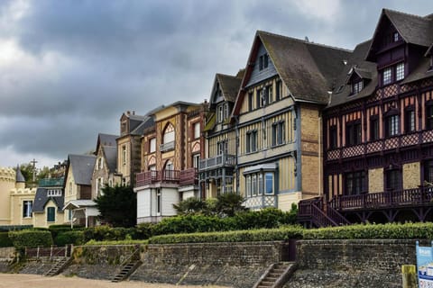 Wander the quaint, historic streets of Trouville-sur-Mer, where Belle Époque architecture meets breezy seaside charm.