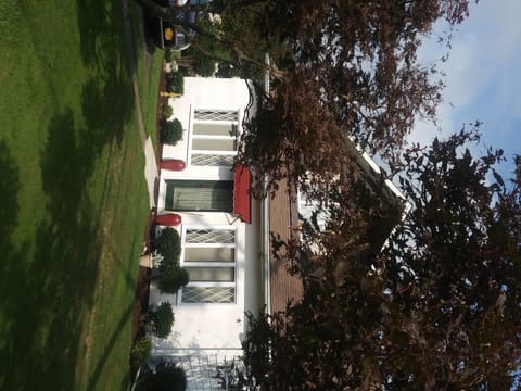 exterior street view of frontage along birneyave. driveway on side st Joyce St.