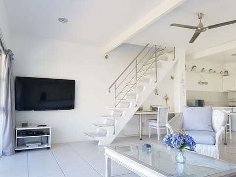 Open - plan lounge with 60'' TV  (full DSTV bouquet)