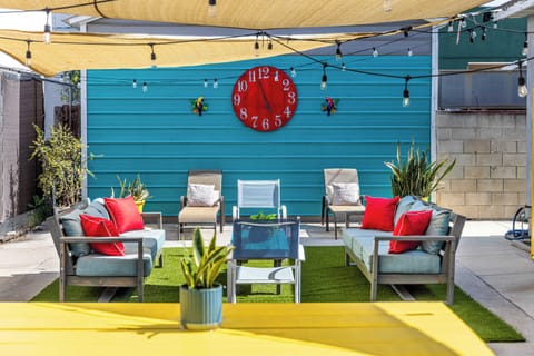 Super fun and vibrant outdoor space to hangout and enjoy the weather! Large dining table, cornhole, sofa seating, BBQ, sun loungers, etc