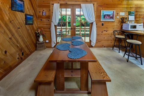 Share meals surrounded by rainforest greenery in this bright and comfortable dining space.
