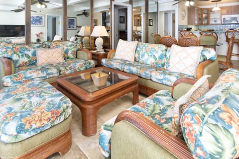 The bright, open great room offers panoramic ocean views from every angle — perfect for gathering, relaxing, and enjoying time with family or friends.