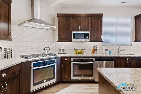 Large gas range, 2 ovens, dishwashers, and fridges