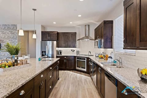 Deluxe kitchen with stainless steel appliances and granite counters 