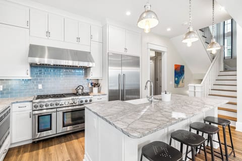 Behind Kitchen is the Powder Room and King Guest Bedroom