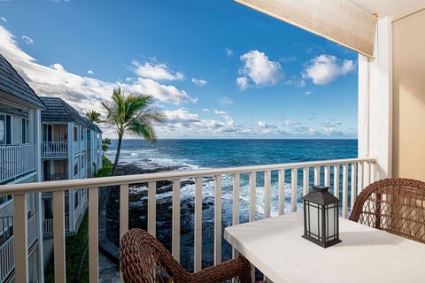 Step onto your lanai that nearly hangs over the ocean, with a dining set perfect for morning coffee or sunset cocktails.
