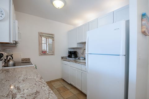 Enjoy a tastefully upgraded kitchen with modern appliances, ample counter space, and island-inspired style.