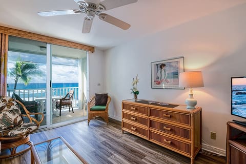 Spacious living area with breathtaking ocean views from both the sofa and windows. Central A/C keeps you cool while enjoying the sound of the waves.