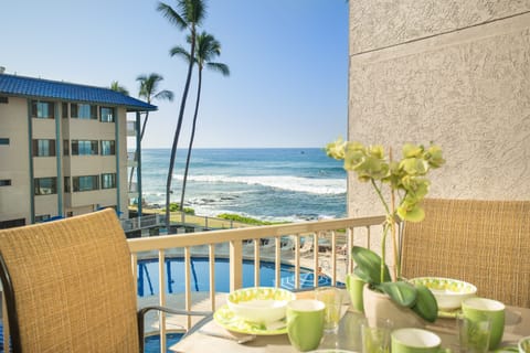View from your lanai; lanai high table and chairs. Spacious lanai with seating for dining or relaxing while enjoying views of the ocean and pool.