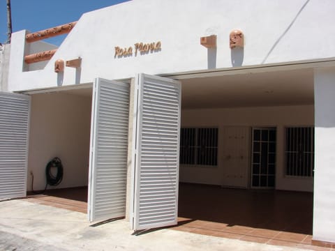 front of house with garage doors open
