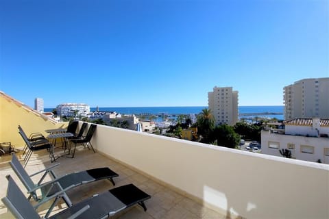 Second terrace on the upper floor with stunning views and extra seating and loungers