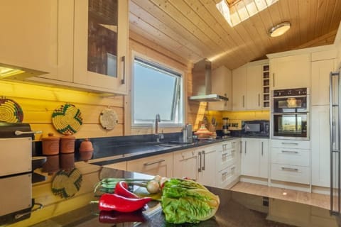 Ground floor: Kitchen with an electric oven, hob,  fridge/freezer and dishwasher