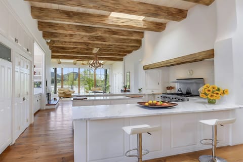Kitchen and living room in the background. Open plan design