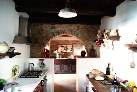 Well equipped kitchen with marble worktops and marble sink