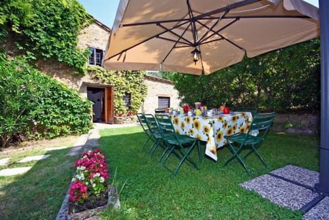 external gazebo equipped with table and benches,