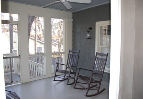Front screened porch with ceiling fan - perfect for cocktails or iced tea!
