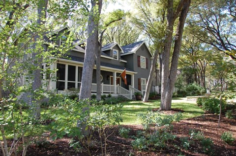 Large front and back yards with many trees and beautiful landscaping