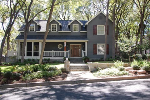 View from street.  Screened porch located on left side of home