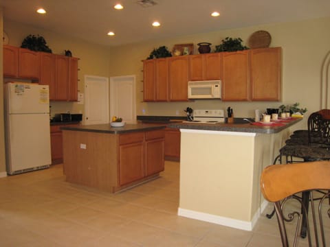Huge 20x16 fully equipped kitchen, breakfast bar seating and an attached nook.