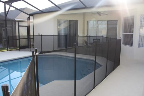 Pool area with child safety fence installed