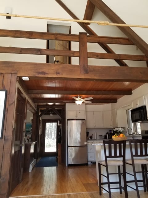 Entry hall and kitchen from living room--bedroom suite door visible upstairs 