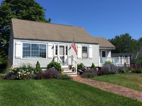 Cheery and bright, newly-renovated beach house within steps of the water. 