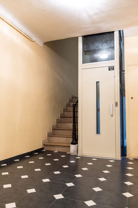 Building entrance with a modern elevator.