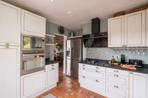 Large fully equipped modern kitchen with access to front terrace area