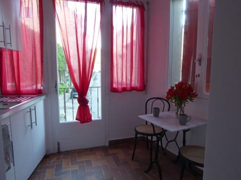 Ground floor bedroom coffee nook with door to balcony.