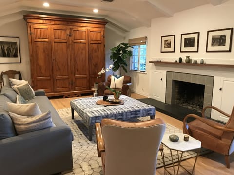 Large living room with vaulted ceiling and fireplace