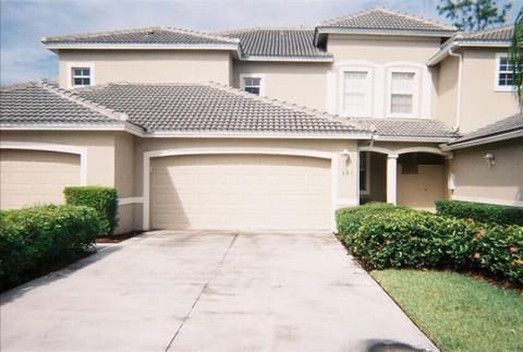 Front of condo has a two car attached garage