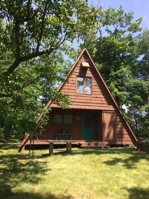 Front view. Main level window is master bedroom. Upper window is largest bedroom
