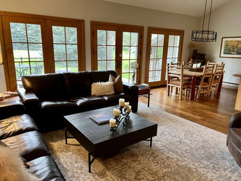 Great Room with wall of windows looking onto the Eagle Vail Golf Course