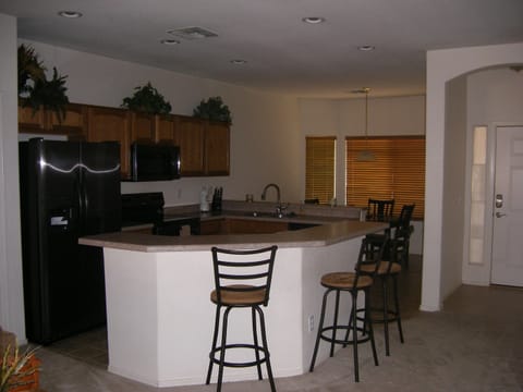 Large open kitchen with bar seating