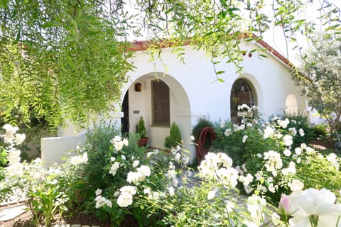 Front porch entrance to the main house on Main St. with patio on the left.