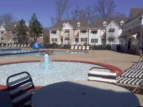 Unit is located near one of the swimming pools and splash pad