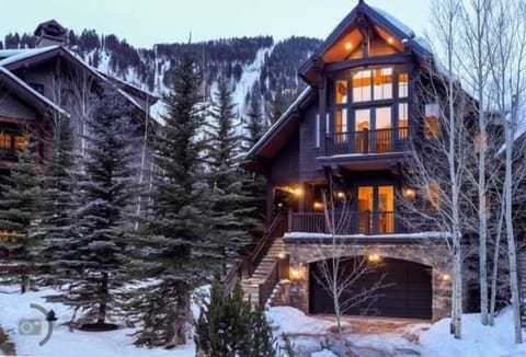 The structure you see next to the house is the Ritz Carlton. Slopes in the back.