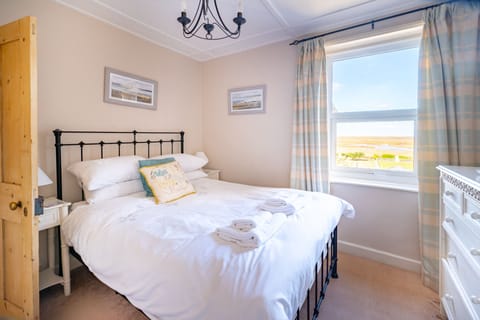 4 Harbour View, Brancaster Staithe: Bedroom two with double bed and marsh views