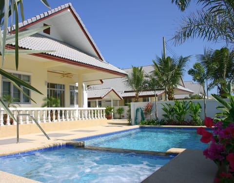 Pool villa wheelchair accessible with pool hoist and bannister.