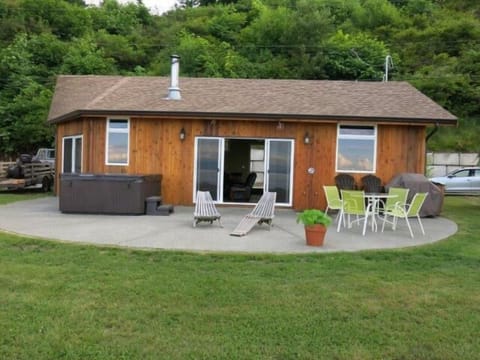 Cottage, view from the beach front showing ample parking by the front door