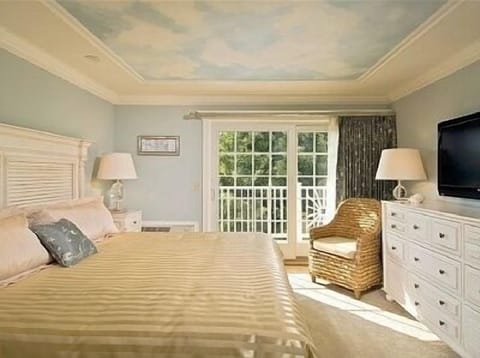 Master Bedroom with balcony overlooking the pool.
