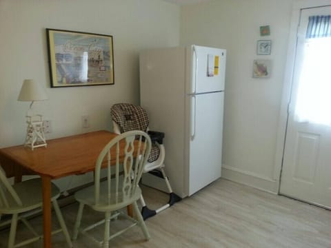 3rd fl. kitchen with 17 CF refrig. Back door leads to outside staircase. 