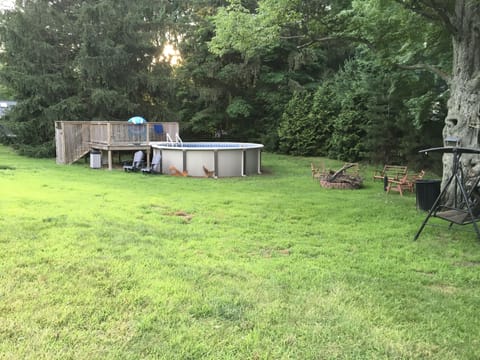 Pool with deck. Pool is not heated, also there is a firepit with seating for six