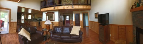 Two story living room. Has TV/DVD w satellite, fireplace