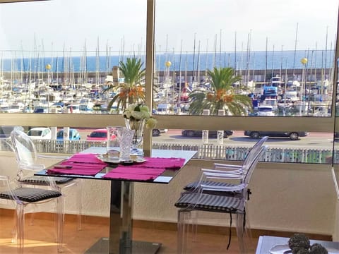dining table with view to the Marina Port and the sea