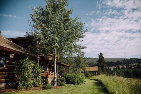 View of rear of main house with guest lodge in background