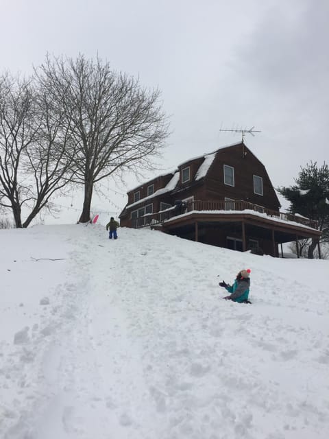 The house is surrounded by amazing sledding hills (sleds included!)